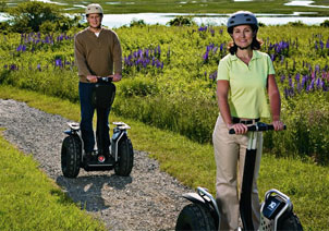 Man and women riding X2 on a trail